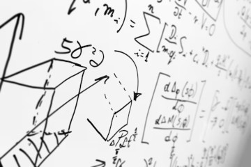 A classroom whiteboard being photographed at the end of a lesson